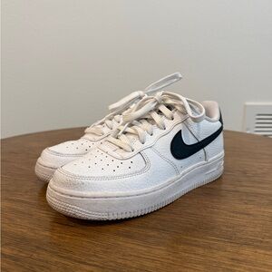 Nike White Sneakers with Black Swoosh